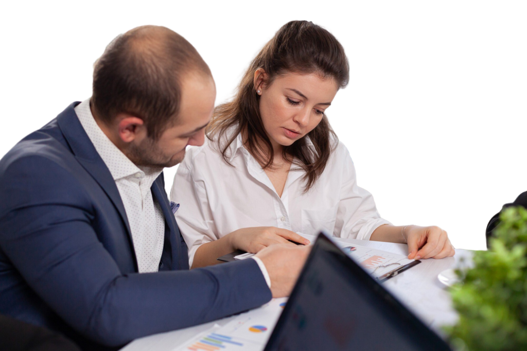 a man and woman looking at papers